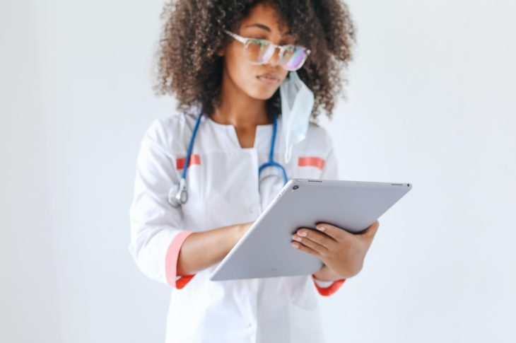 nurse working on a mobile tablet