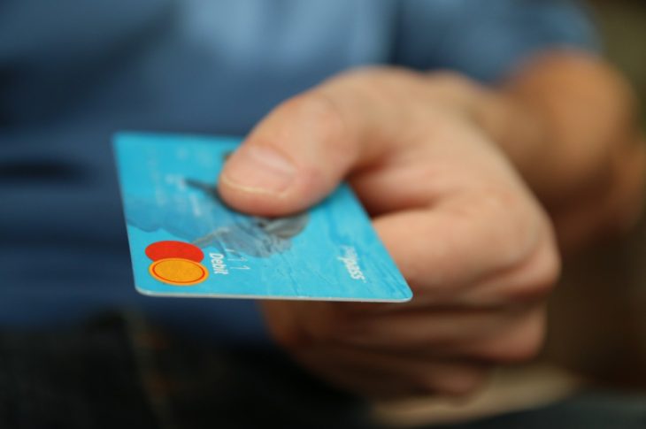 person holding a credit card in their hand